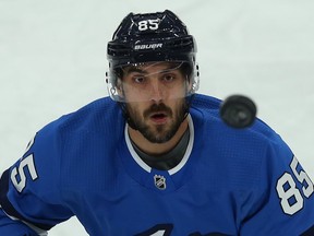 Winnipeg Jets forward Mathieu Perreault was elbowed in the jaw by Canucks' Jake Virtanen on Tuesday, an infraction that went unpunished by both the officials and the league.. Kevin King/Winnipeg Sun/Postmedia Network