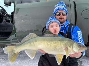 Dylan and Kash Foui with a beautiful Lake Winnipeg walleye. CRAIG STAPON/For the Winnipeg Sun