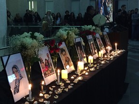 A vigil was held at the University of Manitoba in Winnipeg on Friday, Jan. 10, 2020, to honour the victims of a plane crash in Tehran on Jan. 8. Pictures of the victims were shown on a table adorned with flowers and candles. Candles were lit for each of the Manitoba victims.