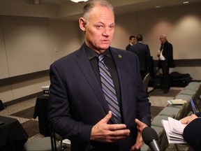 Winnipeg Police Association president Maurice Sabourin speaks to media on Tuesday during a break in an arbitration hearing. The union hopes to convince an arbitrator to quash changes council approved for the Winnipeg police pension plan and seek millions of dollars in damages from the city.
