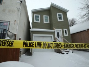 Police tape blocks a home at 516 Alexander Avenue in Winnipeg on Wednesday. Police found a deceased male at the residence on Tuesday and said the circumstances surrounding his death are suspicious. The homicide unit is investigating. On Friday, police confirmed the death as a homicide.