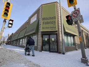 A man passes the front of the Main Street Project warming centre in Winnipeg on Sun., Jan. 19, 2020. Kevin King/Winnipeg Sun/Postmedia Network