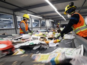 Sorters pick through materials during a media tour of the city's new recycling facility on Mazenod Road in the St. Boniface Industrial Park in Winnipeg on Wed., Jan. 22, 2020. Kevin King/Winnipeg Sun/Postmedia Network