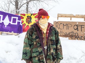A protest in solidarity with Wet'suwet'en anti-pipeline protesters in Kahnawake, blocking the Candiac railway line. Wenhniseri:io is one of the residents in Kahnwake on Monday February 10, 2020 supporting the anti-pipeline protestors. Dave Sidaway / Montreal Gazette ORG XMIT: 63937