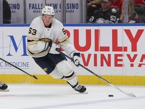 Jeff Skinner of the Buffalo Sabres skates the puck past Phillip Danault of the Montreal Canadiens during the third period of play at the KeyBank Center on January 30, 2020 in Buffalo, New York.