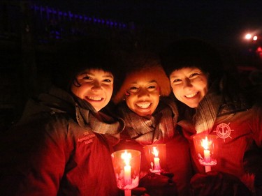 Aquatennial ambassadors representing the Minneapolis Aquatennial hold candles while participanting in Torch Light Walk and the Opening Ceremonies of Festival du Voyageur in Winnipeg, Man., on Friday, Feb. 14, 2020. L-R: Aquatennial princess Jennifer Anderson, Aquatennial Queen of the Lake Elise Toussaint and Aquatennial princess Erin Wesund. The 51st annual Festival du Voyageur runs from Feb. 14 to 23, 2020.