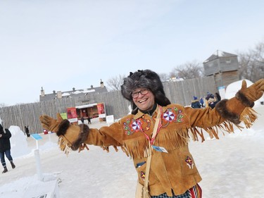 Claude Forest, the son of the late Georges Forest (founder of the Festival du Voyageur), shows his enthusiasm on the opening day of Festival du Voyageur while standing in front of a snow sculpture. The 51st annual Festival du Voyageur in Winnipeg, Man., runs from Feb. 14 to 23, 2020.