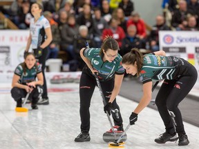 Team Einarson’s Shannon Birchard (right) sweeps during a match at the Manitoba Scotties in Rivers yesterday. The Einarson rink will play in the final this afternoon.  Connie Laliberte/Curl Manitoba