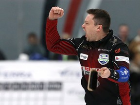 Skip Jason Gunnlaugson pumps his fist toward the stands after winning the provincial men's curling championship over Mike McEwen at Eric Coy Arena in Winnipeg on Feb. 9, 2020. (Kevin King/Winnipeg Sun)
