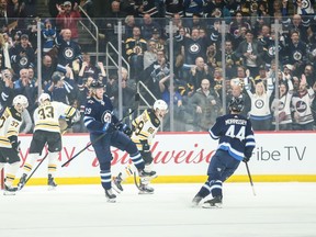 Winnipeg Jets forward Patrik Laine (29) celebrates his goal against the Boston Bruins during the first period at Bell MTS Place on Friday.