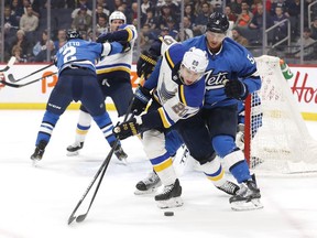 Winnipeg Jets defenCeman Luca Sbisa (5) checks St. Louis Blues left wing Alexander Steen on Feb. 2 at Bell MTS Place. (James Carey Lauder/USA TODAY Sports)