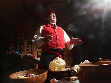 Interpreter Steve Greyeyes talks about what food was like back in 1815 while visitors check out  Festival du Voyageur in Winnipeg, Man., on Sunday, Feb. 16, 2020. The 51st annual Festival du Voyageur in Winnipeg, Man., runs from Feb. 14 to 23, 2020.