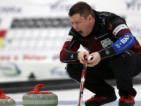 Skip Jason Gunnlaugson calls on the sweepers during the provincial men’s curling championship at Eric Coy Arena in Winnipeg earlier this week. Team Gunnlaugson defeated Mike McEwen by an 8-6 score to book their spot in Sunday’s final, where they could face McEwen again. (KEVIN KING/WINNIPEG SUN)