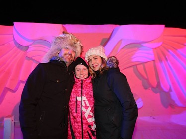 L-R: Steinbach resident Mark Lanouette, his daughter Chloe and his girlfriend Sandy Leoppky are all smiles while standing in front of a snow sculpture at Festival du Voyageur in Winnipeg, Man., on Friday, Feb. 14, 2020. The 51st annual Festival du Voyageur runs from Feb. 14 to 23, 2020.