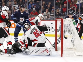 Winnipeg Jets winger Patrik Laine (right)  scores on Ottawa Senators goaltender Craig Anderson during the second period at Bell MTS Place on Saturday. (James Carey Lauder/USA TODAY Sports)