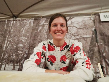 Lauryn Manaigre shows off a vintage Festival du Voyageur sweatshirt given to her my her grandmother while she helps out inside the Sugar Shack at Festival du Voyageur in Winnipeg, Man., on Sunday, Feb. 16, 2020. The 51st annual Festival du Voyageur in Winnipeg, Man., runs from Feb. 14 to 23, 2020.