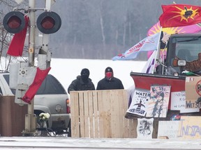 Protesters stand near closed train tracks in Tyendinaga Mohawk Territory near Belleville. What does this mean for the culture of protest?