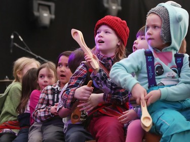 Nine-year-old Samantha Wylie (red toque) plays the wooden spoons while on stage during a performance on the final day of the 51st annual Festival du Voyageur in Winnipeg, Man., on Sunday, Feb. 23, 2020.
