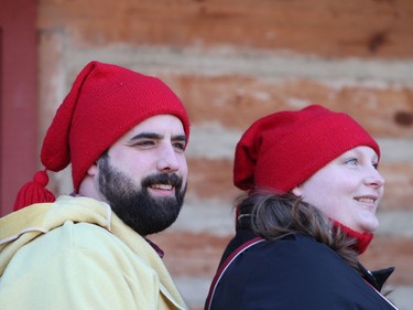 Patrick Girard and his wife Brittany watch the reenactment of the Red River Skirmish between La Compagnie de La Vérendrye and the Forces of Lord Selkirk inside Fort Gilbraltar on the final day of the 51st annual Festival du Voyageur in Winnipeg, Man., on Sunday, Feb. 23, 2020.