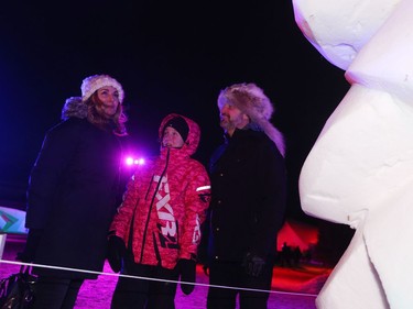 Steinbach resident Mark Lanouette (right), his daughter Chloe (middle) and his girlfriend Sandy Leoppky (left) check out a snow sculpture on the opening day of Festival du Voyageur on Friday, Feb. 14, 2020. The 51st annual Festival du Voyageur in Winnipeg, Man., runs from Feb. 14 to 23, 2020.