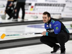 Skip Tanner Horgan tracks his shot during the provincial men’s curling championship at Eric Coy Arena in Winnipeg  earlier 
this week. The third-seeded Horgan foursome fell short of their goal of playing on Sunday. (KEVIN KING/WINNIPEG SUN)