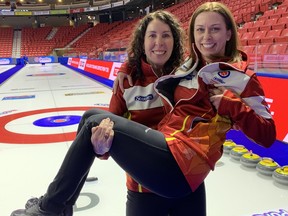 Lori Eddy holds her friend and teammate Alison Griffin at Mosiac Place in Moose Jaw, Sask., site of the 2020 Scotties Tournament of Hearts.