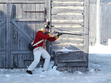 The Forces of Lord Selkirk participate in a reenactment of the Red River Skirmish against La Compagnie de La Vérendrye inside Fort Gilbraltar on the final day of the 51st annual Festival du Voyageur in Winnipeg, Man., on Sunday, Feb. 23, 2020.