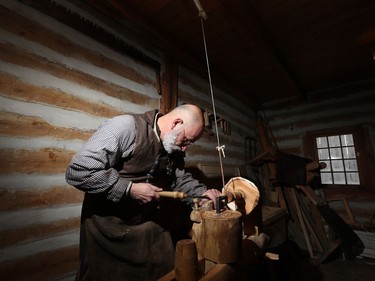 Wood carver Pedro Bedard works on carving a wooden bowl at Festival du Voyageur on Louis Riel Day in Winnipeg, Man., on Monday, Feb. 17, 2020. The 51st annual Festival du Voyageur in Winnipeg, Man., runs from Feb. 14 to 23, 2020.