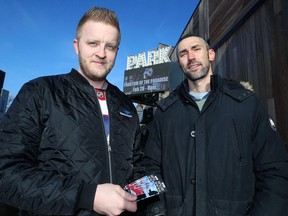 Tim Partridge (right), a paramedic, and Ben Chidwick pose for a photograph outside The Park Theatre on Osborne Street on Sunday. Three bands that include first responders will play a fundraising concert, ResponderPalooza: Songs for Sophie, there on April 7 to assist in the care of Chidwick's three-year-old daughter Sophie, who has a rare genetic neurodevelopment disorder.
