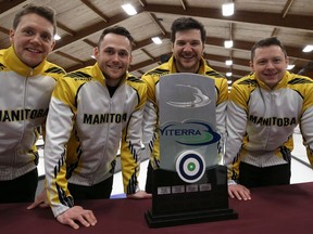 Second Adam Casey, lead Conner Njegovan, third Alex Forrest and skip Jason Gunnlaugson (from left) pose with the Viterra Championship trophy after beating Mike McEwen in the provincial men's curling championship final at Eric Coy Arena in Winnipeg on Feb. 9, 2020.