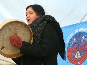 Lisa Muswagon of Cross Lake First Nation performs with a hand drum during the Festival du Voyageur kickoff press conference at Whittier Park in Winnipeg on Thurs., Feb. 13, 2020. Kevin King/Winnipeg Sun/Postmedia Network