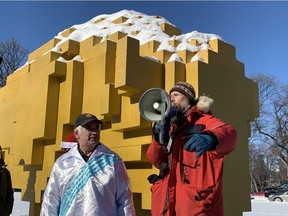 Eric Reder of the Wilderness Committee addresses the crowd while Lance Wood of the Hollow Water First Nation stands by prior a march in solidarity with the Wet'suwet'en Hereditary Chiefs at the Manitoba Legislative Building in Winnipeg on Tuesday, Feb. 18, 2020. The Wet'suwet'en Hereditary Chiefs have been blockading work on the Coastal GasLink pipeline in B.C., which has prompted protests, blockades and marches across Canada. Marchers walked from the Legislative Building to the Manitoba Law Courts and back.