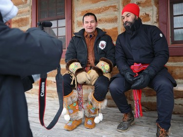 Federal New Democratic Party leader Jagmeet Singh (right) and Manitoba NDP leader Wab Kinew film a video for social media in which Singh opened with 'How do you do? I'm Wab Kinew?' and Kinew said 'What did you bring? I'm Jagmeet Singh' within Fort Gibraltar at Whittier Park as the two celebrate Louis Riel Day at Festival du Voyageur in Winnipeg on Mon., Feb. 17, 2020. Kevin King/Winnipeg Sun/Postmedia Network