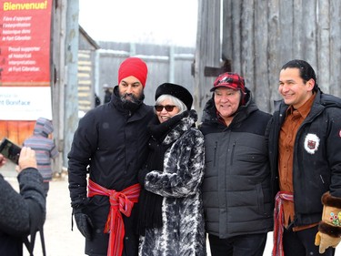 Federal NDP leader Jagmeet Singh (left) and Manitoba New Democratic Party leader Wab Kinew (right) pose for a photo with Mike and Betty Rourke outside Fort Gibraltar at Festival du Voyageur in Winnipeg on Mon., Feb. 17, 2020. Kevin King/Winnipeg Sun/Postmedia Network