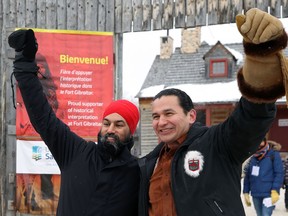 Federal NDP leader Jagmeet Singh (left) and Manitoba NDP leader Wab Kinew give their best 'He Ho' as they celebrate Louis Riel Day at Festival du Voyageur in Winnipeg on Monday.