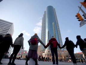 A group of protesters briefly blocked traffic at Portage Avenue and Main Street, in Winnipeg.  Police diverted traffic around the protest.  Wednesday Feb. 26, 2020. /Chris Procaylo/Winnipeg Sun