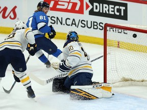 Winnipeg Jets forward Kyle Connor watches his shot go past Buffalo Sabres goaltender Carter Hutton during Tuesday's game. (KEVIN KING/Winnipeg Sun)