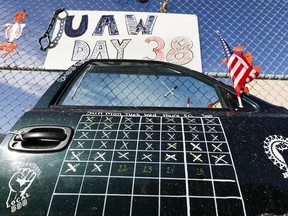 A truck door with a calendar on it that shows the number of days that the UAW-GM strike has lasted is shown at the General Motors Flint Assembly plant on October 23, 2019 in Flint, Michigan.