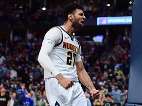 Denver Nuggets guard Jamal Murray reacts following a basket against the Milwaukee Bucks earlier this season. (USA TODAY SPORTS)