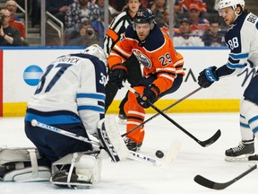 Edmonton Oilers' Leon Draisaitl (29) is stopped by Winnipeg Jets goaltender Connor Hellebuyck (37) at Rogers Place on Saturday, Feb. 29, 2020.