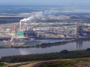 The Suncor mine facility along the Athabasca river as seen from a helicopter tour of the oil sands near Fort McMurray, Alta., Tuesday, July 10, 2012. (THE CANADIAN PRESS/Jeff McIntosh)