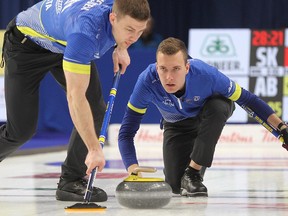 Team Alberta skip Brendan Bottcher releases a rock as Brad Thiessen sweeps during the 1-2 game against Saskatchewan at the Brier in Kingston, Ont., on Saturday, March 7, 2020.