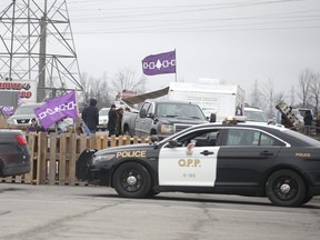 Native protestors block two ends of Hwy 6 in Caledonia in support of the Wet-suwet'en pipeline dispute and the OPP removal of the blockade in Belleville on Monday on Tuesday February 25, 2020.