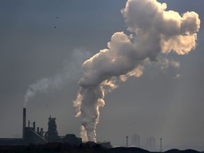 Steam rises from a plant in an industrial zone in Hamilton, Ontario, Canada May 13, 2017.