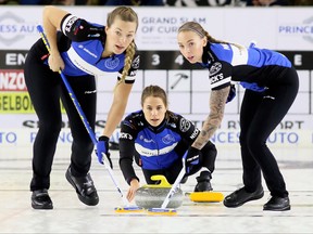 Skip Anna Hasselborg, left, of Sweden throws a rock as second Agnes Knochenhauer, left, and lead Sofia Mabergs sweep during the women's final at the Grand Slam of Curling's Princess Auto Elite 10 tournament at Thames Campus Arena in Chatham, Ont., on Sunday, Sept. 30, 2018. Hasselborg and her Swedish teammates were just arriving by plane, after spending time at a training camp in Calgary, when they were informed that the World Women’s Championship had been cancelled, just two days before they were supposed to start play, because of the coronavirus pandemic.