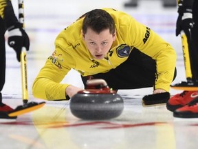Team Manitoba skip Jason Gunnlaugson delivers while taking on Quebec at the Brier in Kingston, Ont., on Sunday, March 1, 2020. THE CANADIAN PRESS/Sean Kilpatrick