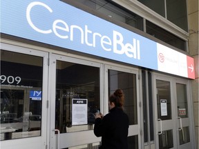 A sign at a Bell Centre entrance on March 12, 2020, informs patrons that all events, including Canadiens games, are suspended until further notice due to the coronavirus pandemic.