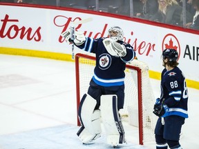 Winnipeg Jets goalie Connor Hellebuyck (37) celebrates after defeating the Vegas Golden Knights 4-0 at Bell MTS Place on Friday.