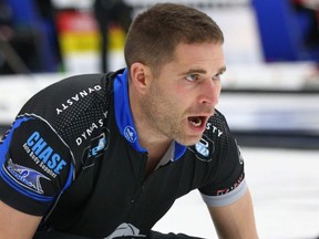 John Morris calls sweepers at the Pinty's Grand Slam of Curling Humpty's Champions Cup event in Calgary on April 25, 2018.