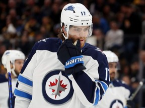Adam Lowry is returning to the Jets starting lineup tonight. Getty images file
